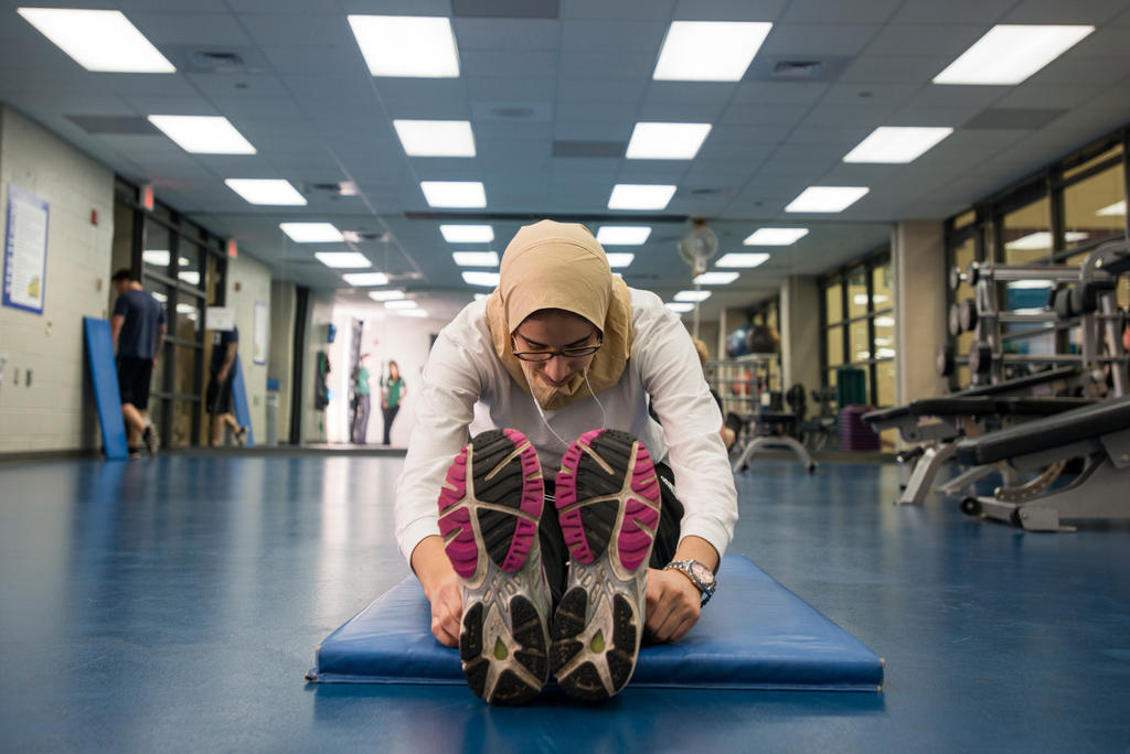 Person stretching in Mason recreation center
